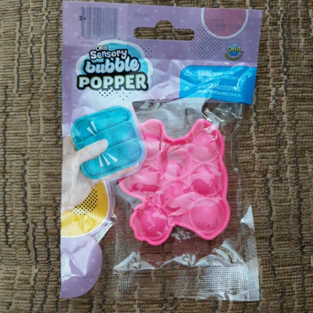 #677 NWT ORB Sensory bubble mini popper. Pink cat paw